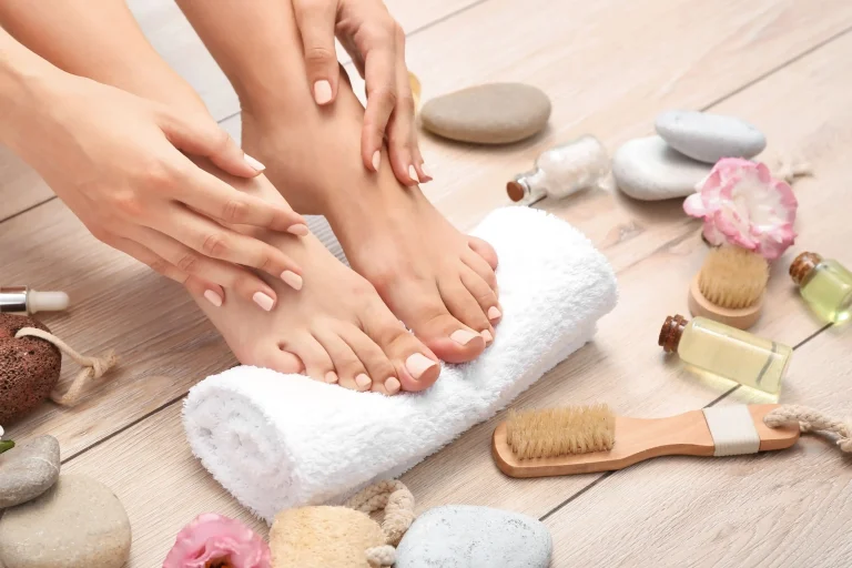 Woman enjoying foot spa and pedicure session