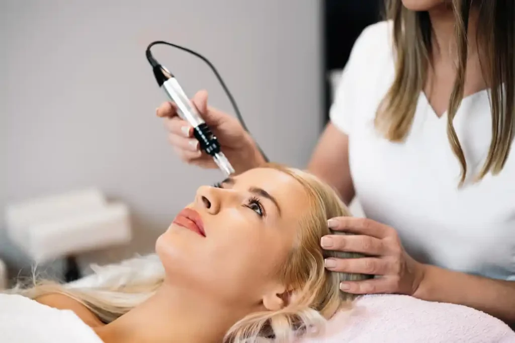 Dermatologist performing microneedling facial treatment